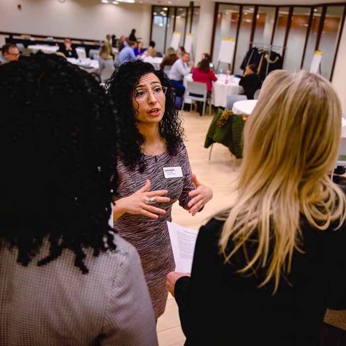 Professional individuals partake in a critical conversations workshop.