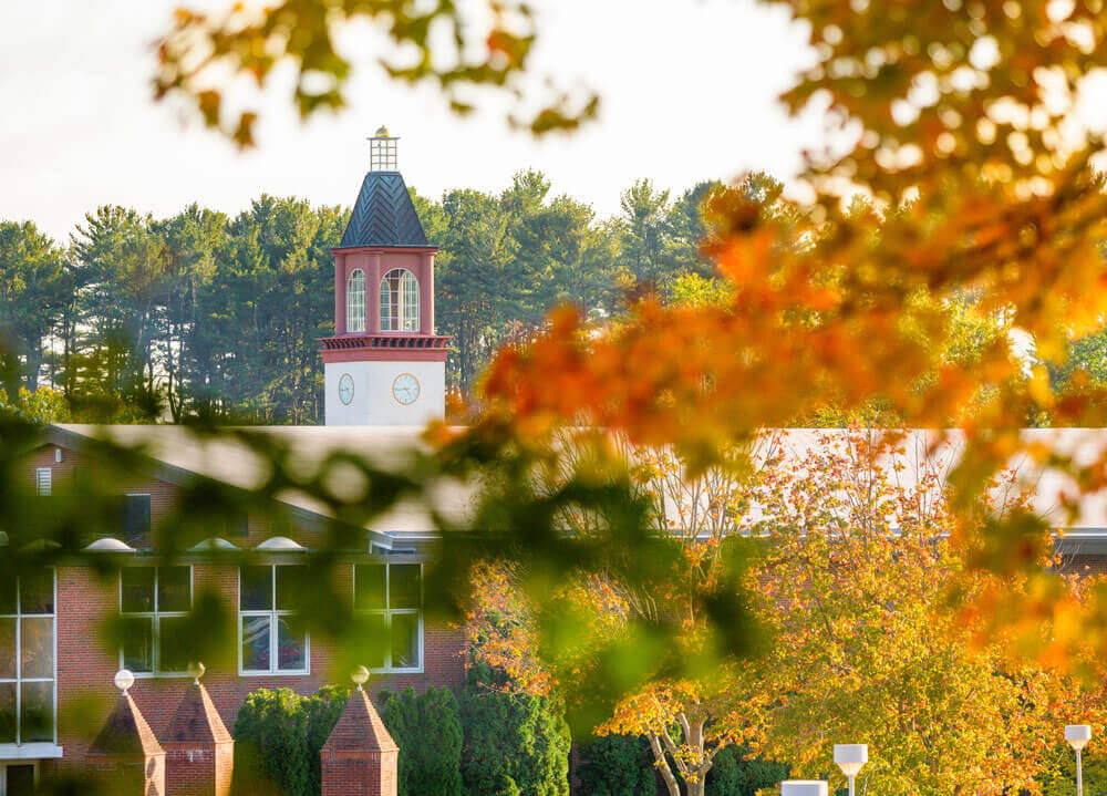 Arnold Bernhard Library in the distance through autumn trees