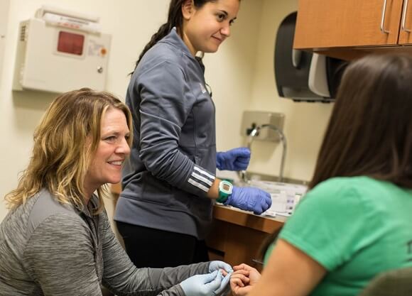 Professor Karen Myrick conducts research on the effects of running on the body.